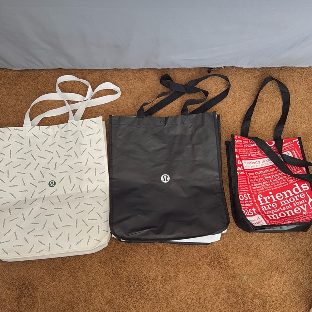 Lululemon shopping bags-2 big ones and 1 small one